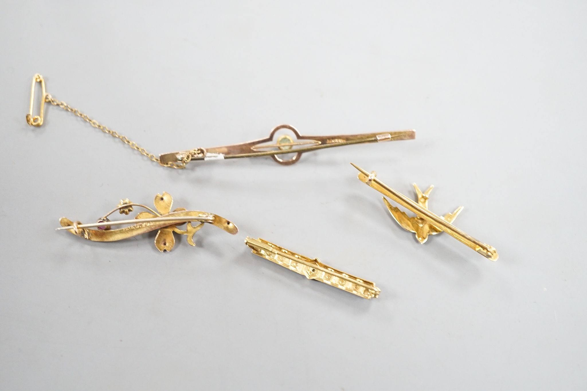 Three assorted 9ct and gem set bar brooches, including a swallow brooch, gross 5.9 grams and one other yellow metal and diamond chip set bar brooch, gross 1.7 grams.